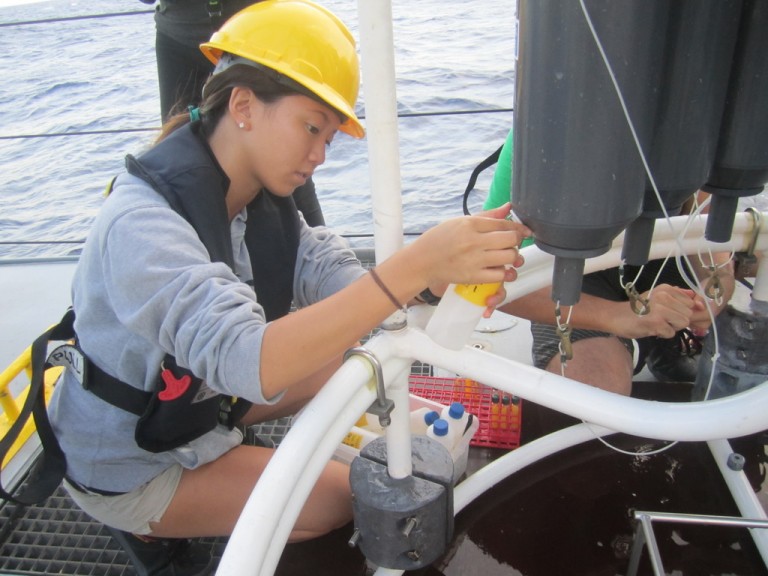 Whitney Ko collecting biological samples.