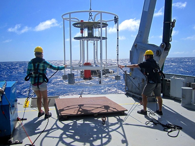 Caitlin Demers and Ted Conroy helping with deployment of the CTD (without sample bottles attached). 