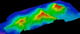 A 3-D view of three seamounts the team has imaged, from left to right they are unnamed, Academician Berg, and Turniff. 