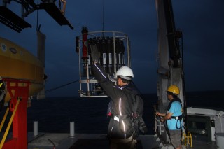 First Mate Philip and Ko-ichi deploy the CTD-rosette at first light this morning. 