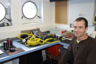 Daniel with the cameras we’ll be using on Nereus for Leg 2, donated to WHOI by James Cameron along with the DEEPSEA CHALLENGER which will be visiting Washington DC today.