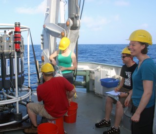 Fill yer boots! From left to right, Sean, Jill, Cody and Meg get started sampling the first CTD cast to come on deck this morning. By the end of the day, Meg’s smile had not diminished but she was pretty much speaking in vowels only by the time she went to get some sleep.