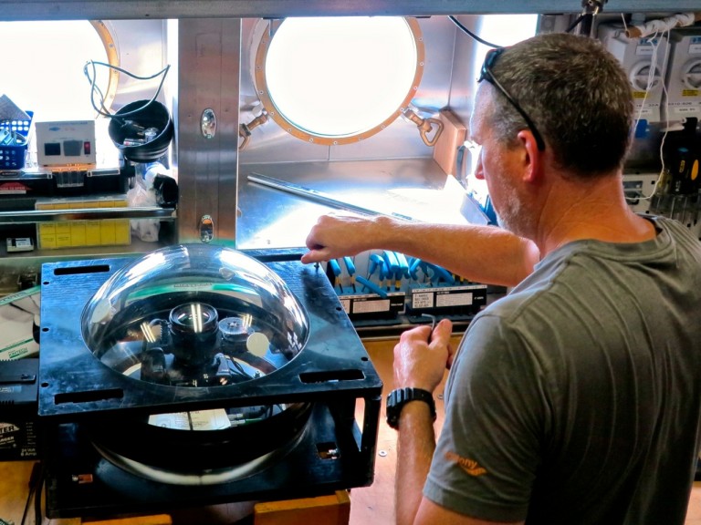 Greg Rouse prepping a lander camera system.