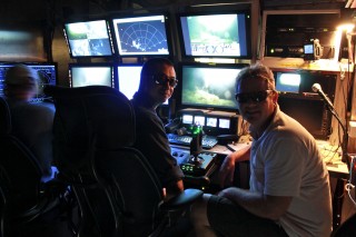 Chief Scientist Peter Etnoyer and ROV pilot Toshinobu Mikagawa wearing their 3D glasses in the ROV/AUV hanger.