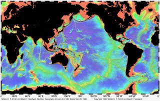 This image from Smith and Sandwell depicts the Seafloor Topography, a data set from which many mapping surveys are planned in areas with little or no multibeam data.