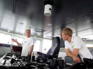 Dr. Cabell Davis (left), Chief Scientist aboard the R/V Falkor works with 2nd/3rd Officer Paul Shepherd to decide upon an ideal speed and heading for the next VPRII recovery.