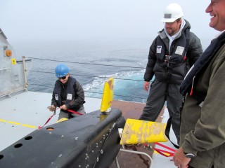 Researchers and crew aboard the Falkor secure the VPRII to the aft deck after a regularly scheduled launch and tow.