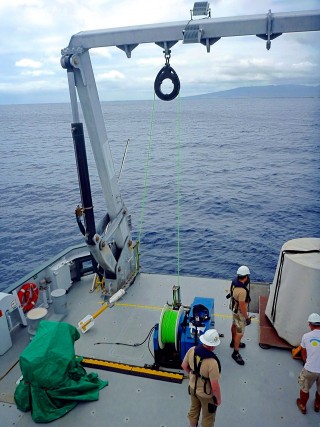 Deploying the magnetometer off Oahu. 