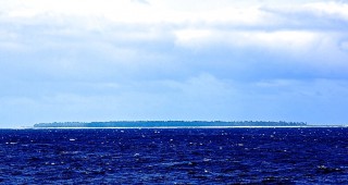 A view of Midway Atoll--from afar because the team's research permit for work in the strictly regulated monument does not allow launching of small boats or visits to the islands.
