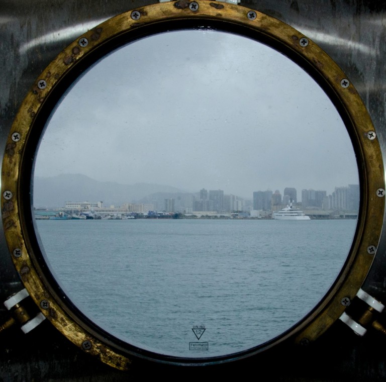 A porthole view of the Honolulu harbor. 
