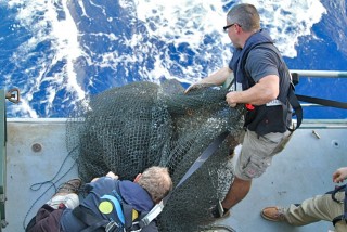 The crew retrieves as many pieces of floating garbage as they could.