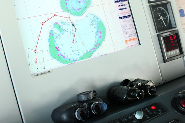 Binoculars and Digital navigational maps on the bridge as Falkor approaches its first destination at Scott Reef