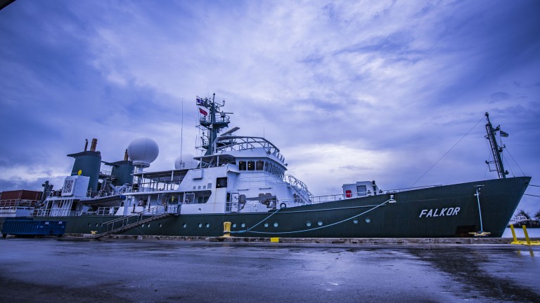 R/V Falkor prepares to begin the Hydrothermal Hunt research cruise under stormy skys in Guam.