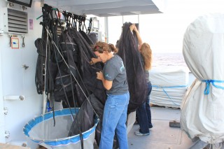 Chief scientist Erica, packs up the nets from the MOCNESS.