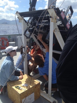 The science team and Falkor crew work diligently on setting up the MOCNESS for the first plankton tow of the cruise.