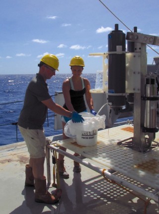 Water from the Sirena Deep. Dr Stuart Piertney and Chloe Weinstock retrieve water collected with the SOI Rock Grabber Lander from the Sirena Deep, 35,000 ft. 