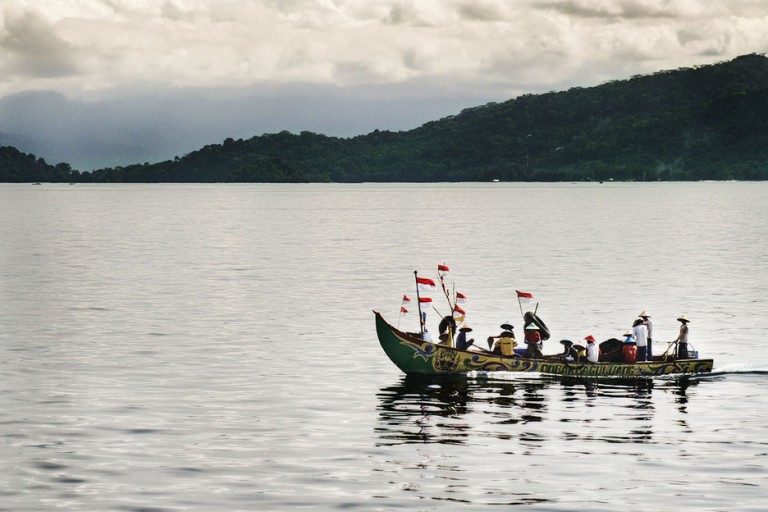 Local fishermen and transport boats greet R/V Falkor next to Sumatra. 