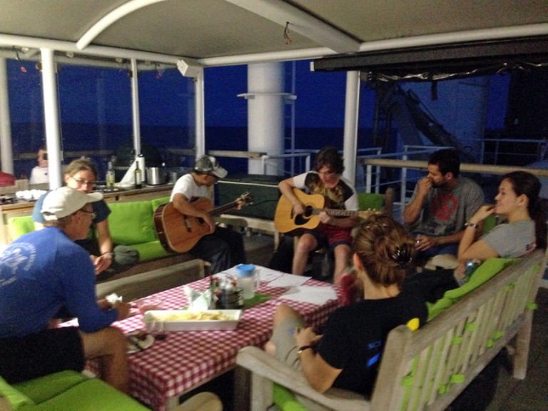 Scientists and crew enjoying live entertainment before setting sail. 