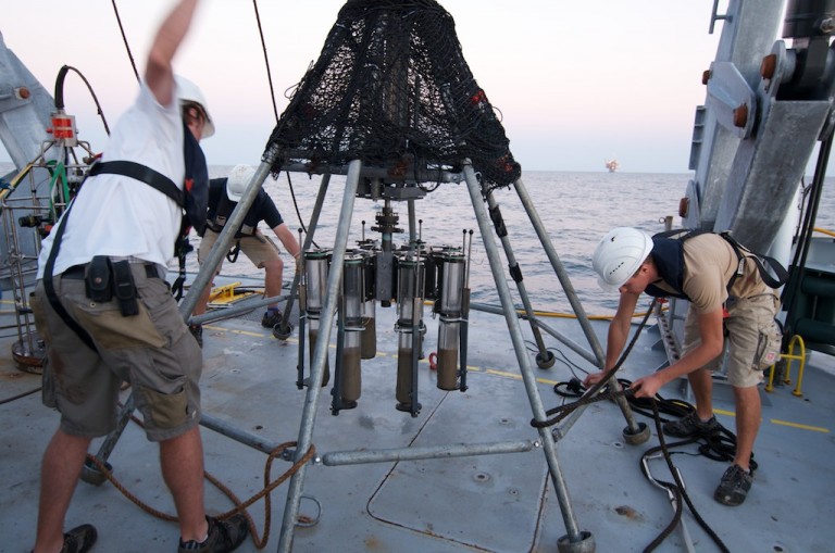 The multicore instrument retrieves eight cores of sediment for researchers to process onboard R/V Falkor. 