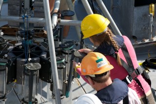 Graduate student Caroline Johansen practices setting the spring mechanism on a multicore liner.