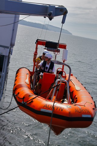 SOI 2nd officer Paul Shepherd and deckhand Mateusz Wroblewski launching a small boat for the run to shore.