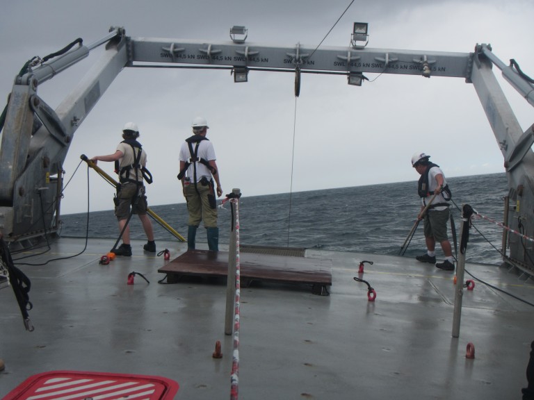 Engineers often get right into the science duties - in this case helping to recover the CTD (note the angle of the ship deck to the ocean!). 