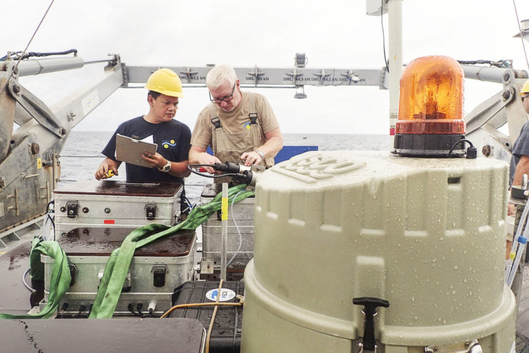 Fitter Edwin Pabustan and Chief Engineer Allan Watt repair one part of the Sea Surface Scanner that was damaged while working.