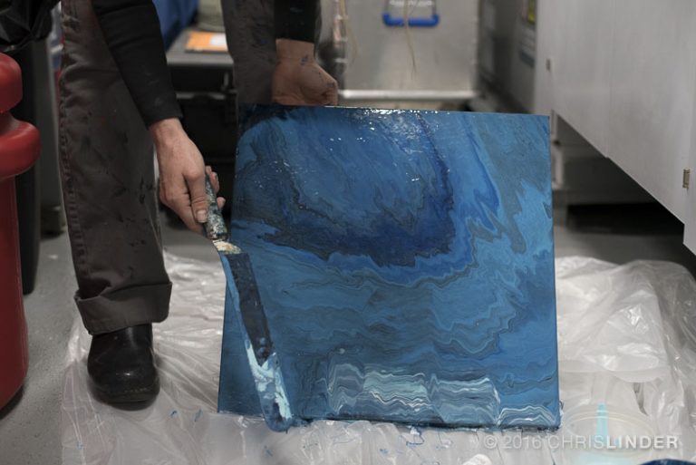 Rutstein works on the first layer of a painting on R/V Falkor.