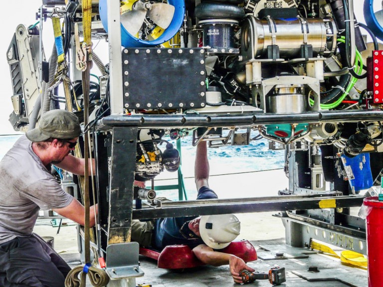 ROPOS crew constructing the ROV on Falkor's aft deck.