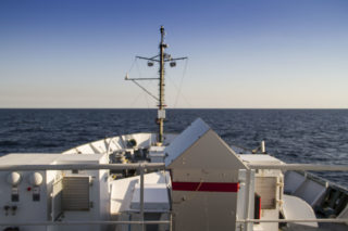 The aerosol sampler sits in the bow of R/V Falkor, automatically vacuuming the air and filtering it. 