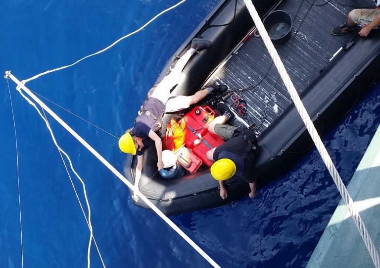 The science team calibrates equipment using tungsten carbide spheres which have a known signal in the water column.