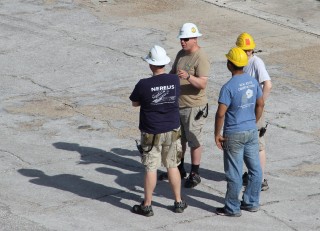 Members of the team plan the careful dance of offloading Nereus and Oases 2013 equipment.