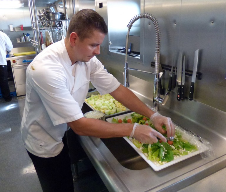 Chef Arkadiusz Ochocki prepares a salad. 