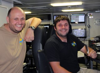 Shake your tail feather. Nathan and Leighton, happy with GPS restored. Note that Leighton is holding a treasured “calling card” from Janet. According to Lars who had to stay up on that mast hosing things down for quite a while, that wasn’t all Janet left us to remember her/him by!