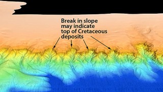 This close-up image of the Campeche Escarpment from the 2013 Falkor sonar survey shows the proposed contact between rocks of Cretaceous age (below) and younger rocks (above).