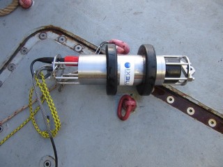 The "dingle-dangle" or the "dunker" (acoustic release signaling device). This is put over the side of the ship and it sends an acousticsignal to the lander to release its weights so it can float to the surface.