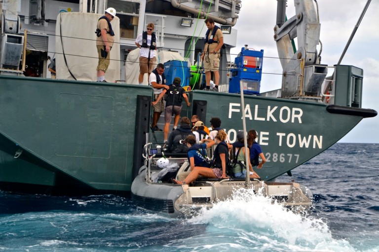 Members of the leg two team boarding Falkor off Oahu.