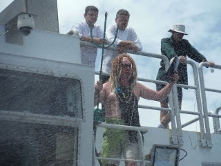 King Neptune visits Falkor to oversee the transformation of the scientists and crew from pollywogs to shellbacks.