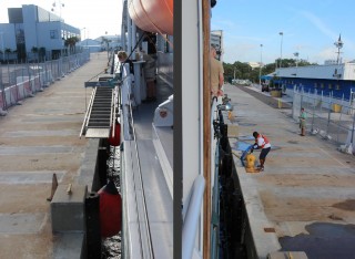 Time to raise the gangplank and cast off lines from shore. [That’s Andy Bowen in the green shirt making sure he has booked his flights to Jamaica!]