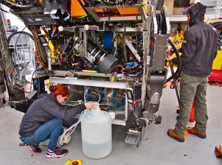 Lisa Allen preparing the Large Volume Water Sampler for a dive. 