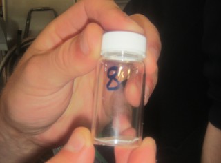 Vial with glass filter inside awaiting measurement.