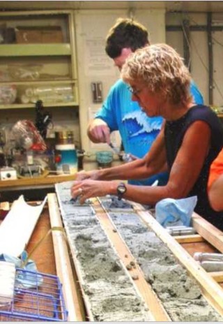Linda Tatreau and C. Geoffry Wheat examinie a core taken from a Mariana mud volcano in 2003 aboard the R/V Thomas G Thompson (TN154). 