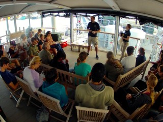 Captain Heiko Volz and Verena Neher welcome the student teams on the upper deck.