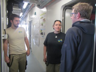Science and ship crew discussing options for deploying research equipment.
