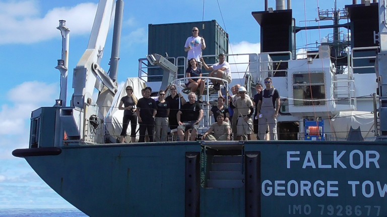 The science party and crew gather for a photo around the CTD.