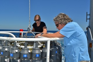 Maureen Trnka (left) and Harriet Nash (right) getting the CTD rosette ready for the next deployment.