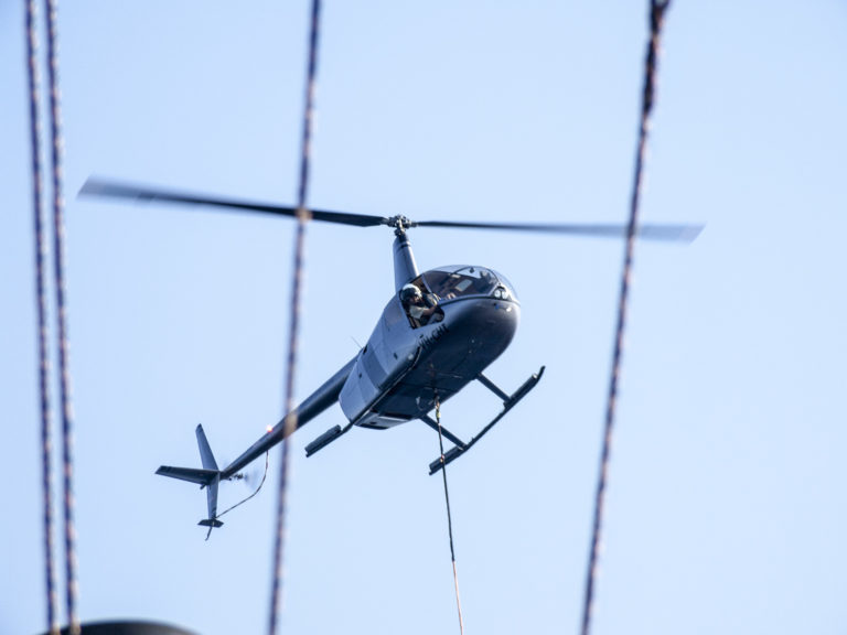 A helicopter delivers the parts necessary to fly this expedition's UAVs.