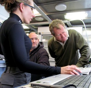 Researcher Melissa Patrician, Marine Technician Robert Hagg, and Research Engineer Fred Thwaite, all of the Woods Hole Oceanographic Institution analyze data gathered by the VPRII on July 19, 2012.