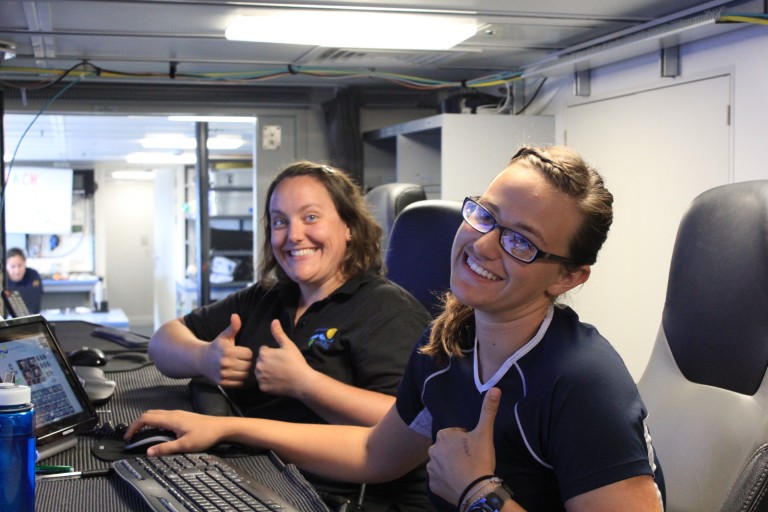 Julianna Diehl and Lead Marine Technician Colleen Peters in the control room.