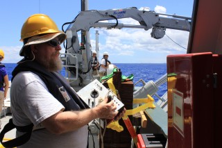 Al Duester from the AUV Sentry team, remotely controls Sentry from Falkor during the first open water test. 